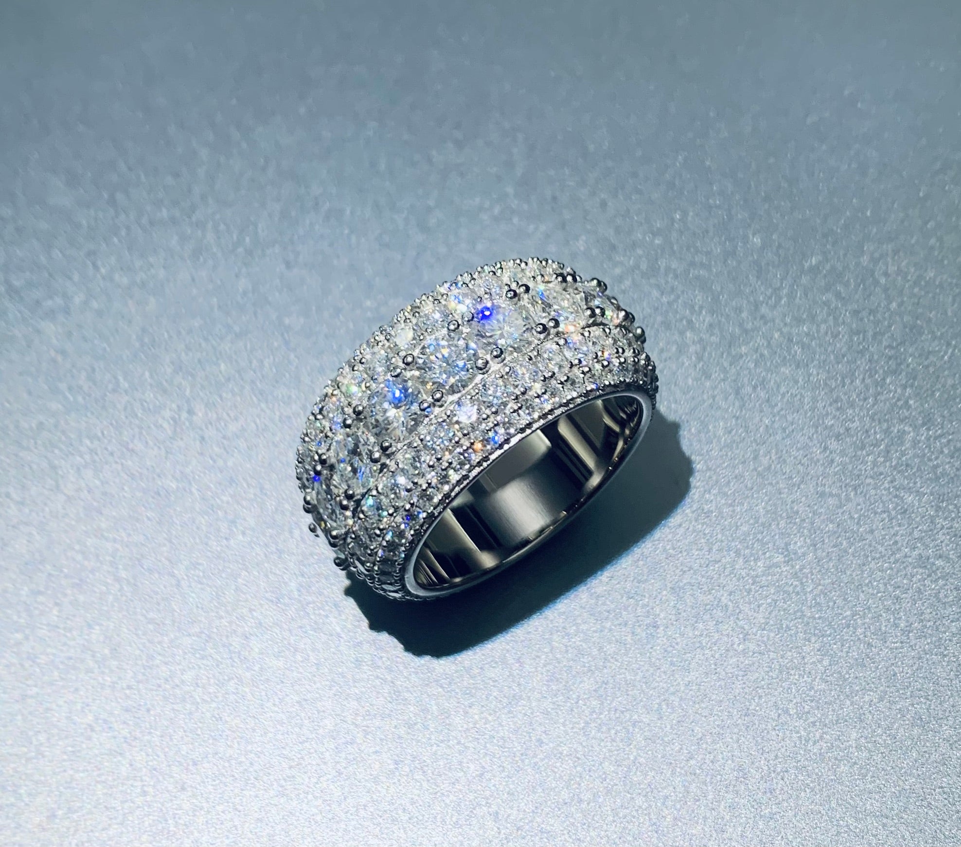 Silver-tone 13mm iced band ring on a white background