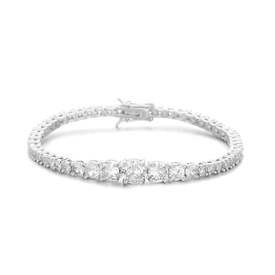 Silver-tone graduated tennis bracelet on white showing the larger center stones