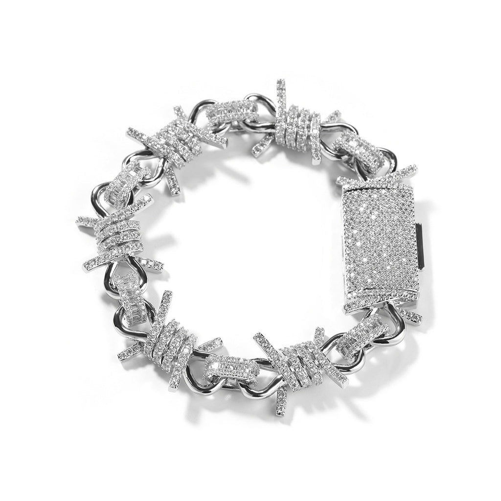 Silver iced barbed wire chain bracelet on white background