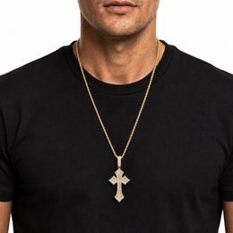 Gold iced cross pendant necklace on black shirt