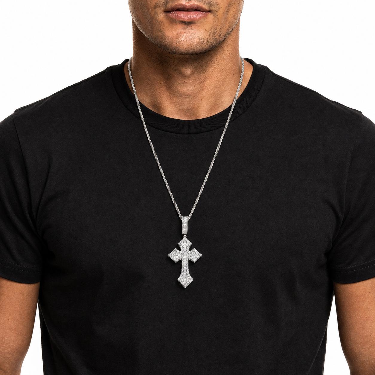 Silver iced cross pendant necklace on black shirt