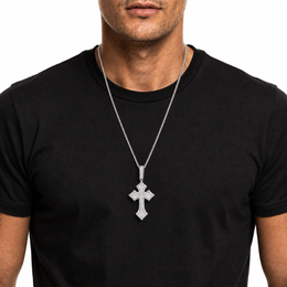 Silver iced cross pendant necklace on black shirt