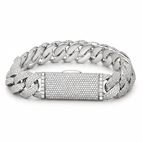 Silver-tone pavé Cuban bracelet on white showing its box clasp and smooth inner links