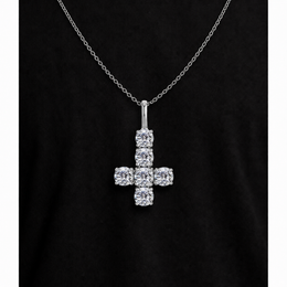 Silver iced inverted cross pendant on black fabric
