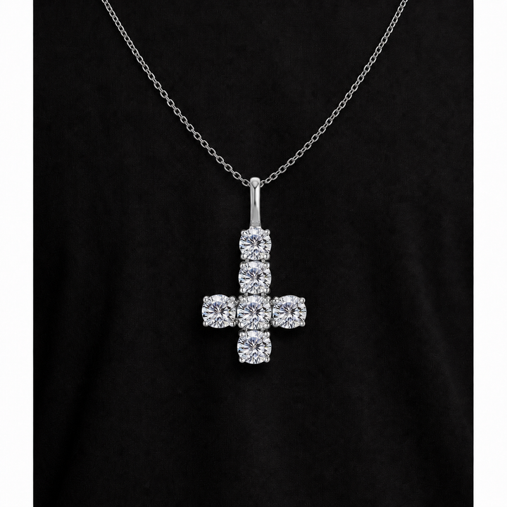 Silver iced inverted cross pendant on black fabric