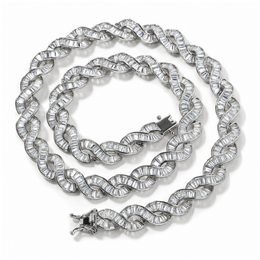 Silver-tone DNA spiral necklace coiled on white, showing baguette stones and open clasp