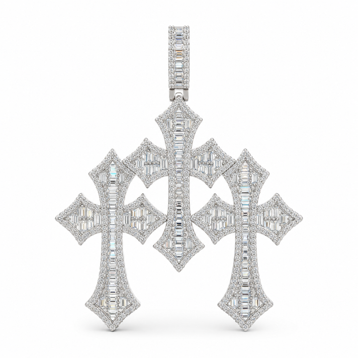 Silver-tone triple Gothic cross pendant with clear stones on white
