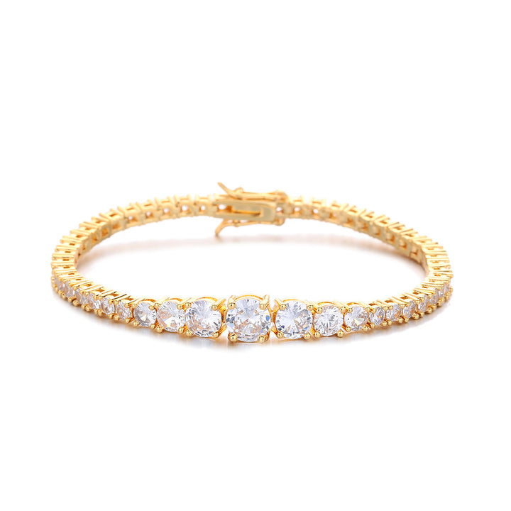 Gold-tone graduated tennis bracelet on white showing the larger center stones