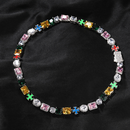 Multicolor cross link necklace arranged in a circle on black fabric