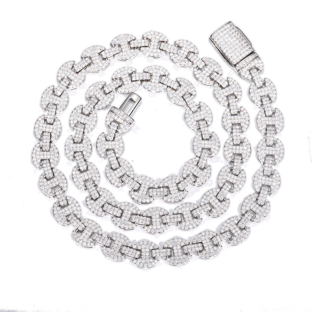 Silver-tone moissanite mariner chain coiled on white with its open box clasp