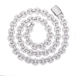 Silver-tone moissanite mariner chain coiled on white with its open box clasp