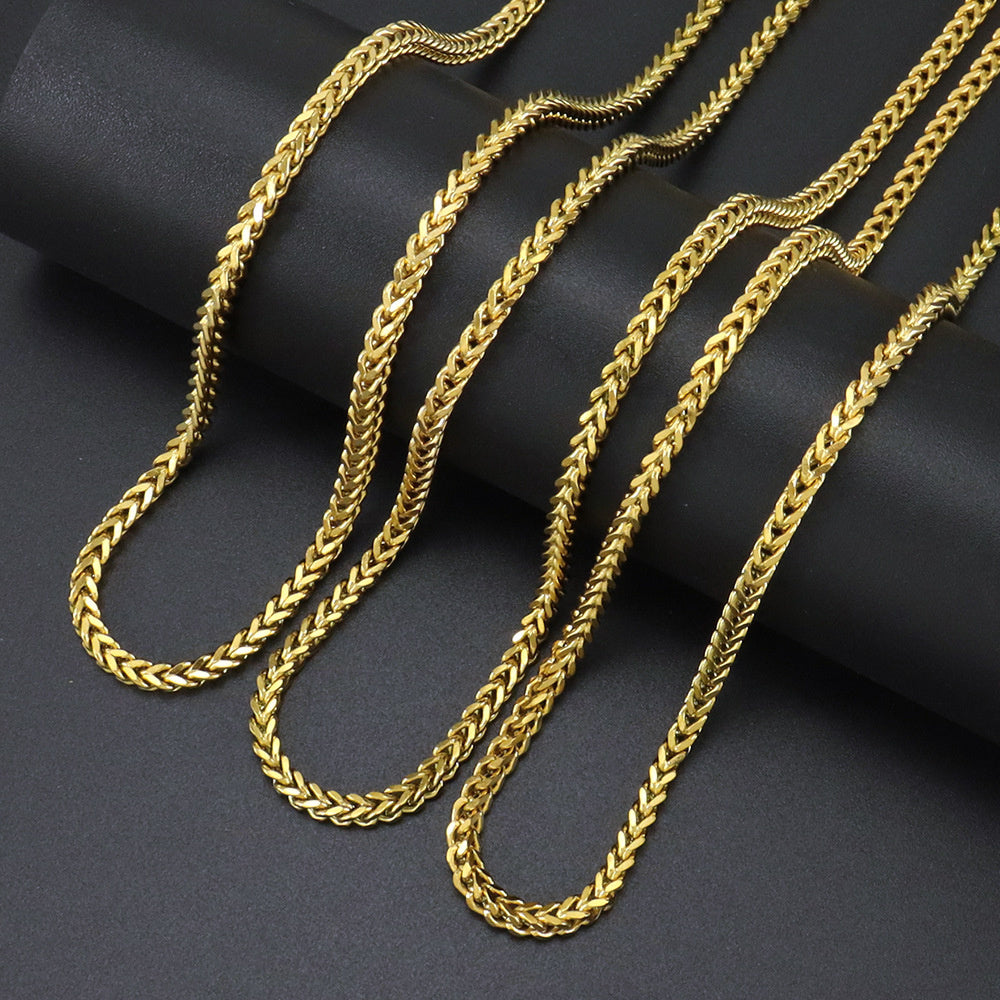 Gold 3mm Franco Chain lengths arranged on black fabric