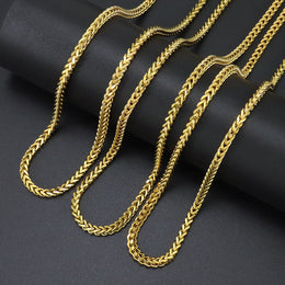 Gold 3mm Franco Chain lengths arranged on black fabric