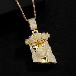 Gold iced Jesus Piece pendant on black background