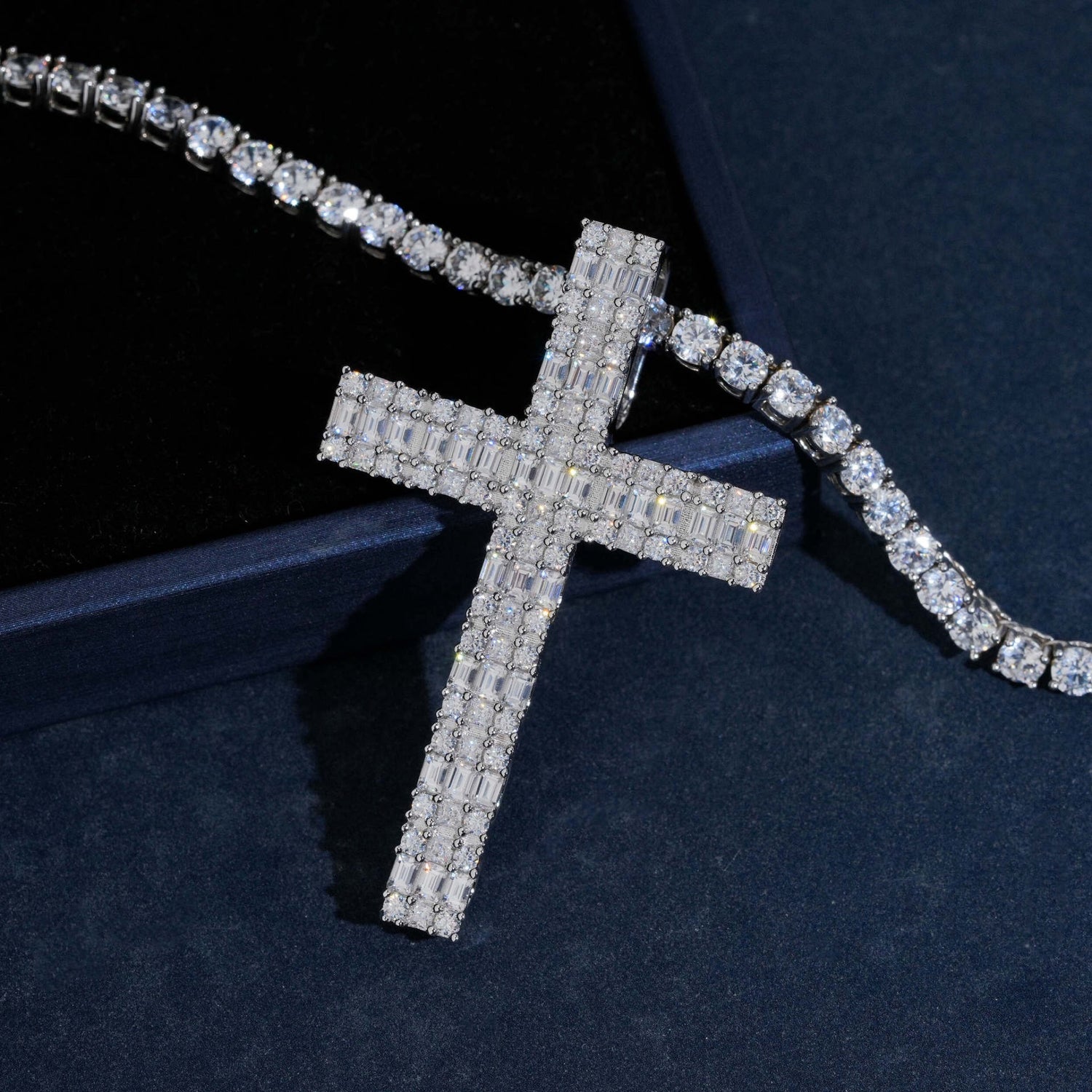 Silver iced moissanite cross pendant angled close-up