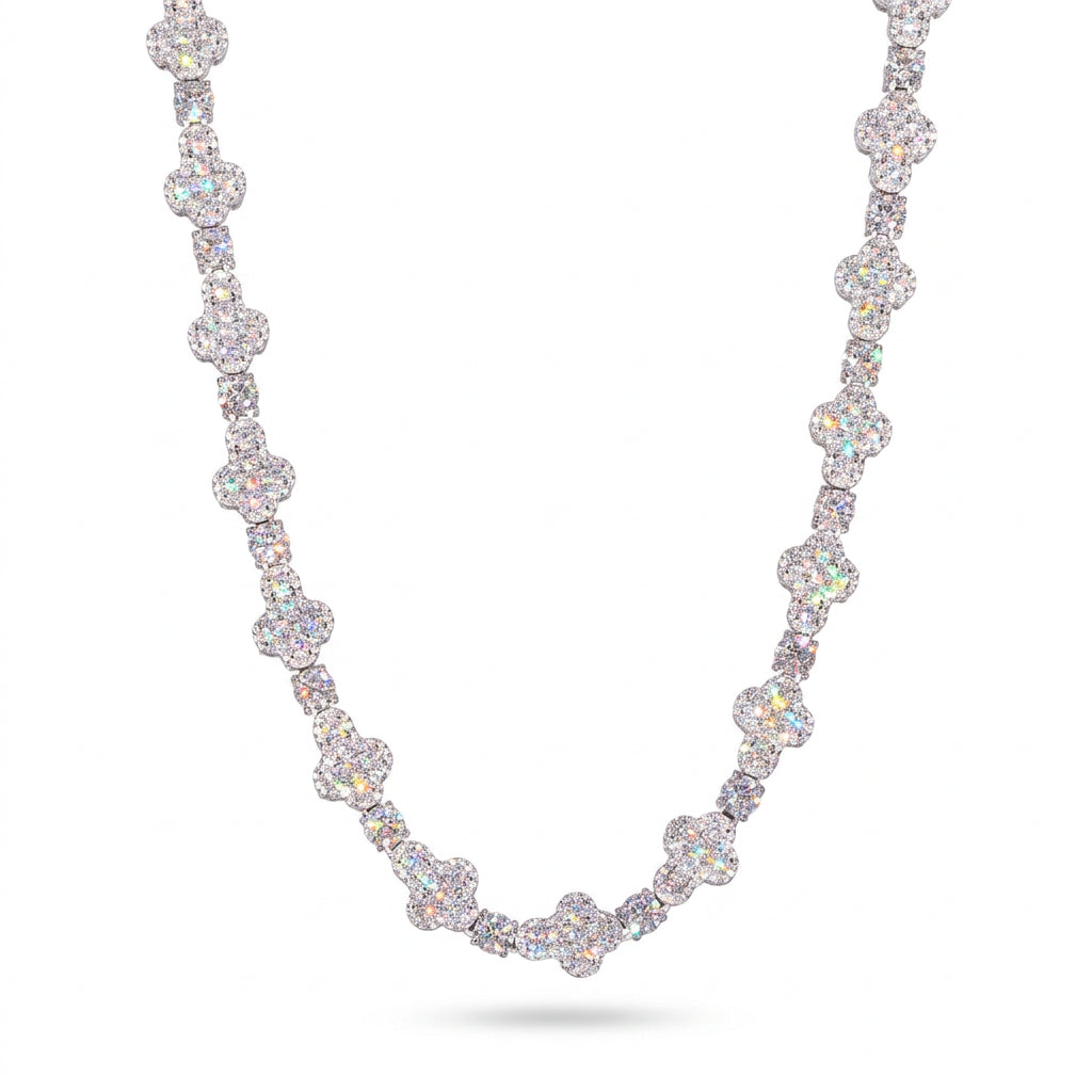 Silver-tone moissanite cross tennis chain draped against a white background