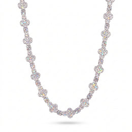 Silver-tone moissanite cross tennis chain draped against a white background
