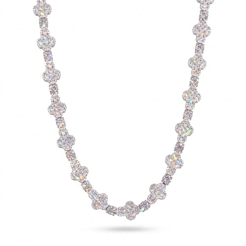 Silver-tone moissanite cross tennis chain draped against a white background