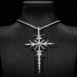 Silver iced thorn cross pendant displayed on black bust