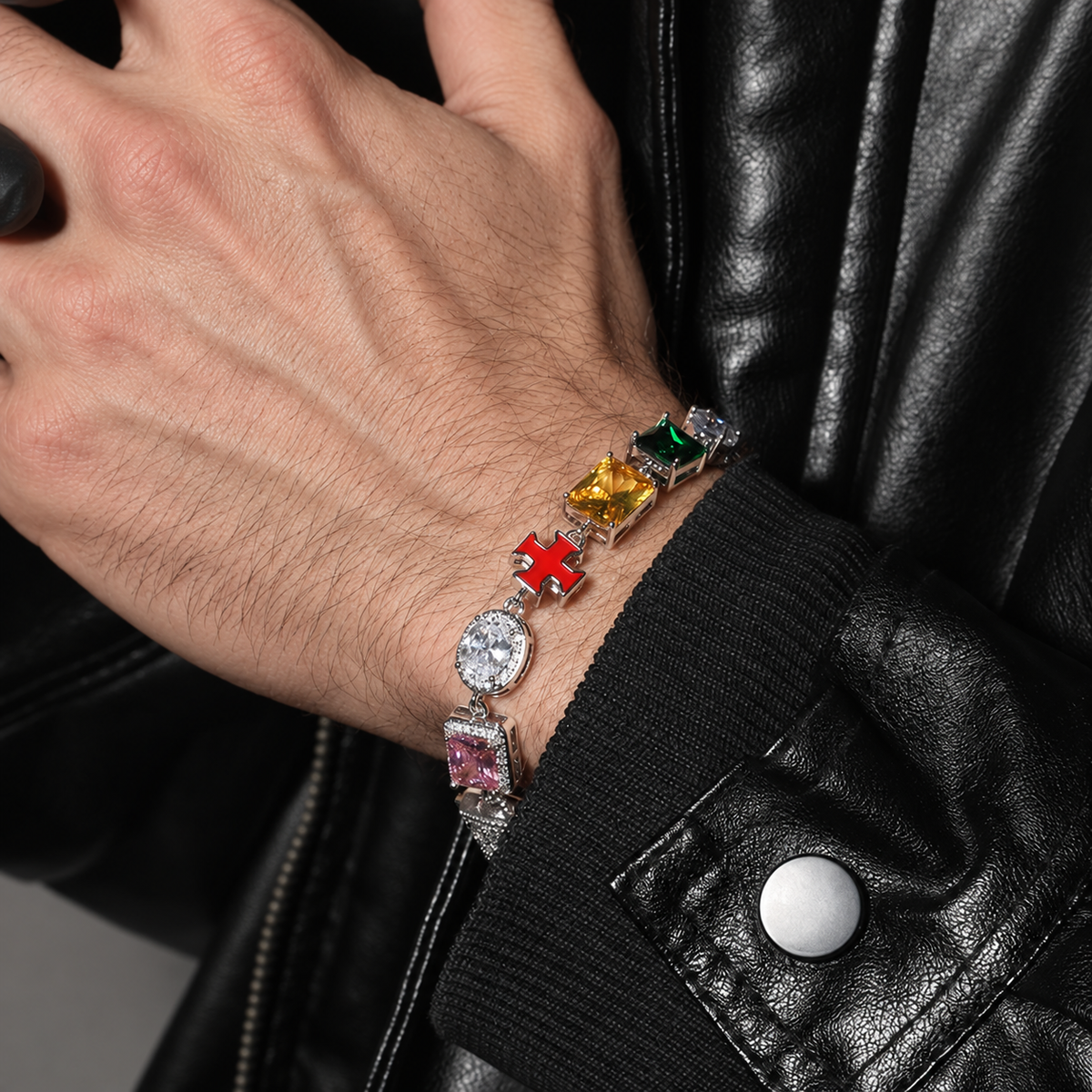 Multicolor bracelet worn on a wrist beside a black leather cuff
