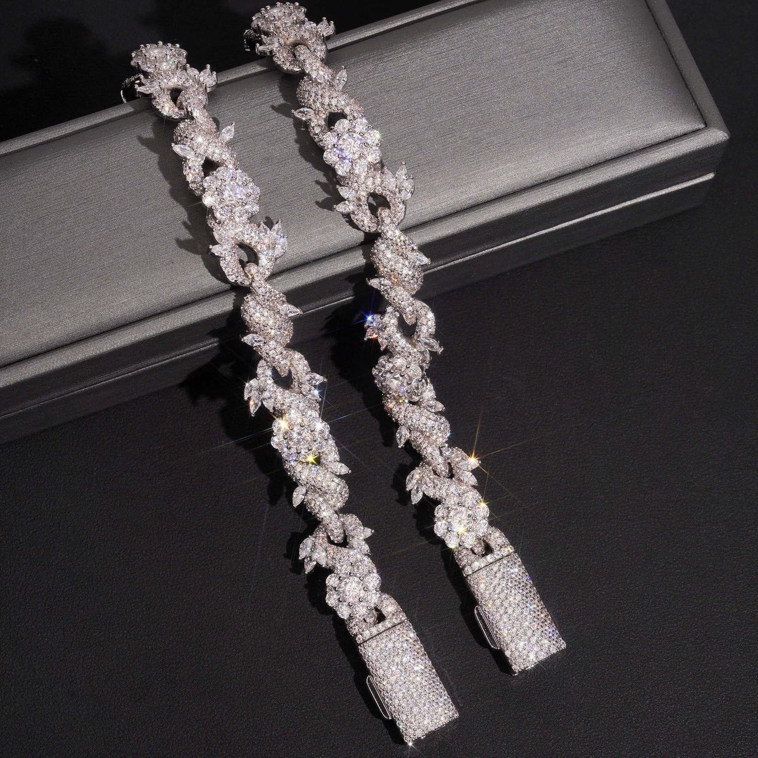 Detailed view of 15mm silver iced flower Cuban chains