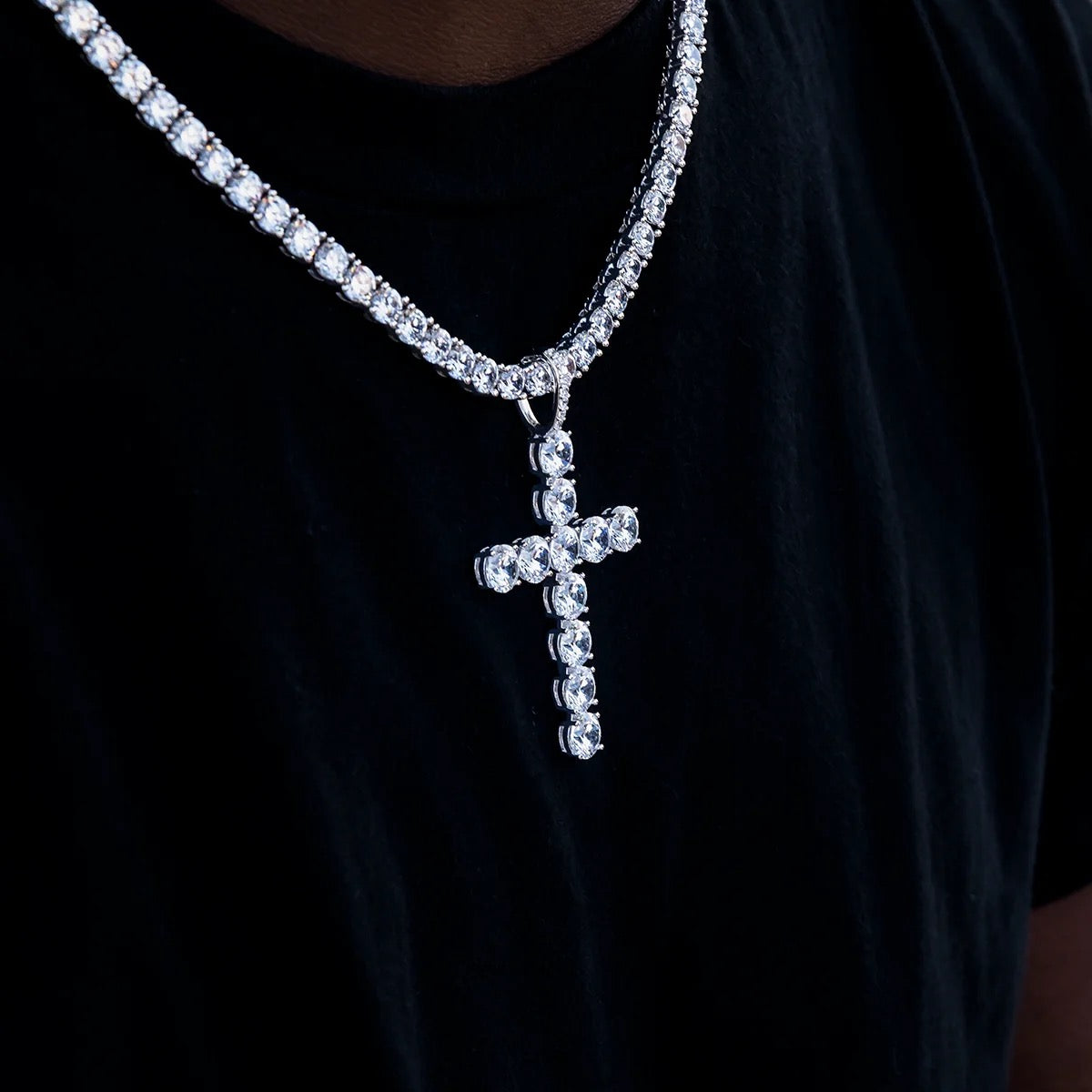 Close-up detail of 6.5mm moissanite cross pendant stones