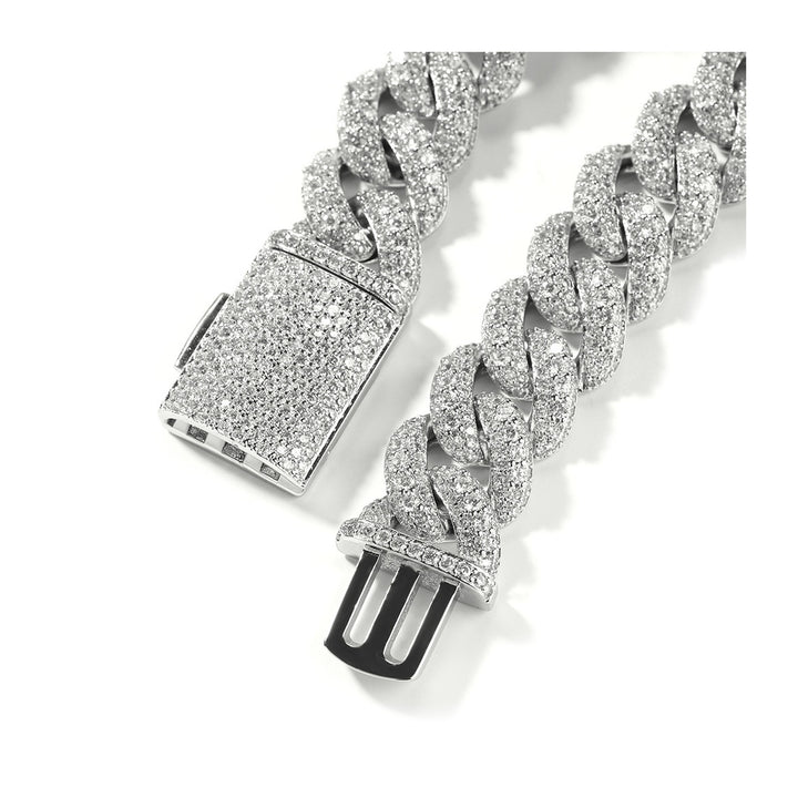 Open clasp on a silver-tone wide stone-set Cuban link necklace