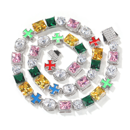 Multicolor cross link necklace coiled on white with its box clasp open