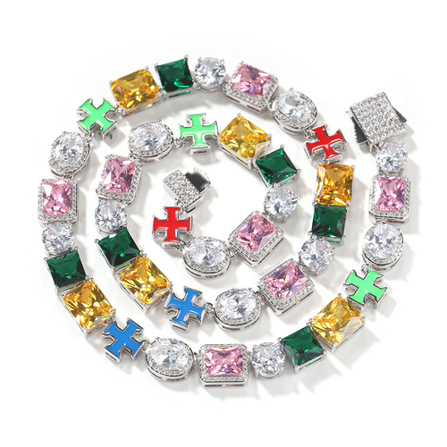 Multicolor cross link necklace coiled on white with its box clasp open