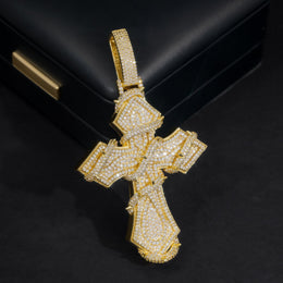 Gold-tone iced thorn-wrapped cross pendant, angled view