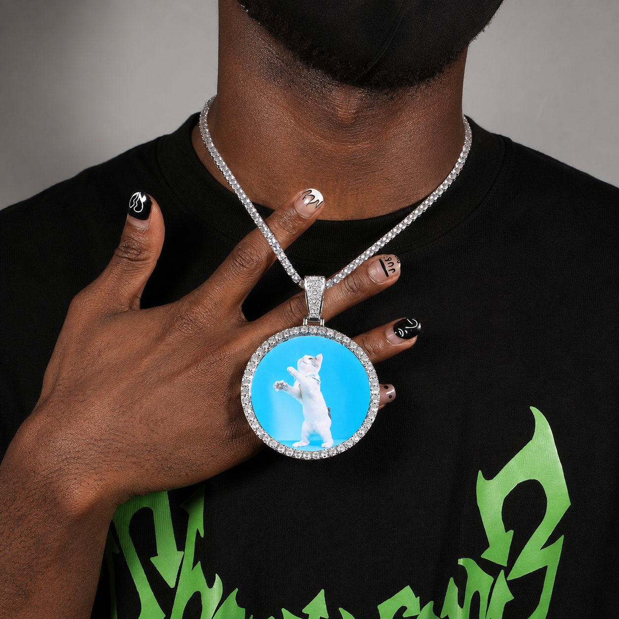 A model showing a round custom photo pendant