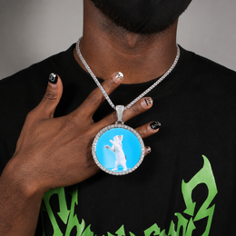 A model showing a round custom photo pendant