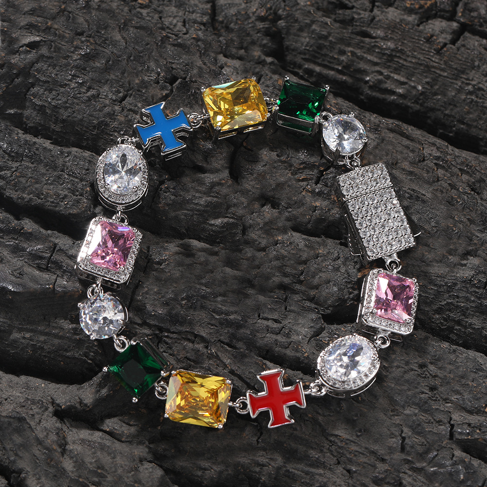 Silver-tone multicolor bracelet with a box clasp arranged on dark textured rock