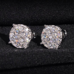 Silver ice crystal moissanite stud earring pair on black fabric