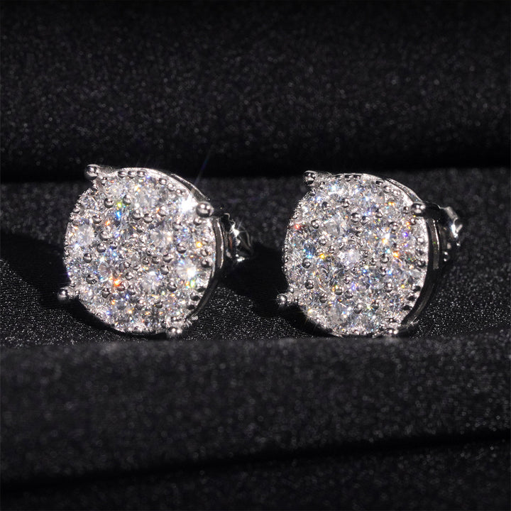 Silver-tone clear-stone cluster stud earrings on black fabric