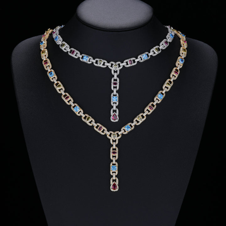 Silver- and gold-tone multicolor lariat necklaces displayed on a black bust