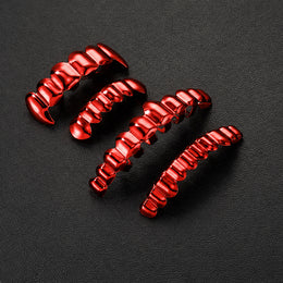 Red grillz in different widths arranged on a dark textured surface