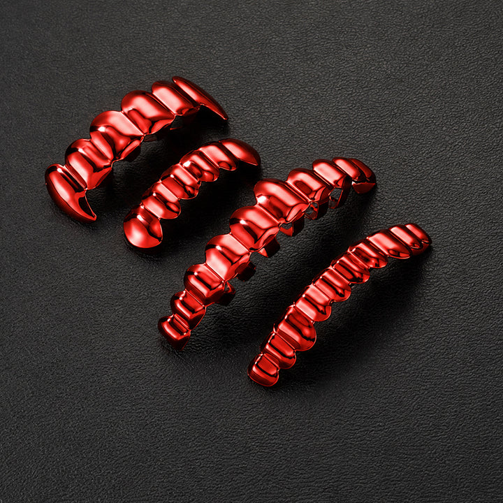 Red grillz in different widths arranged on a dark textured surface