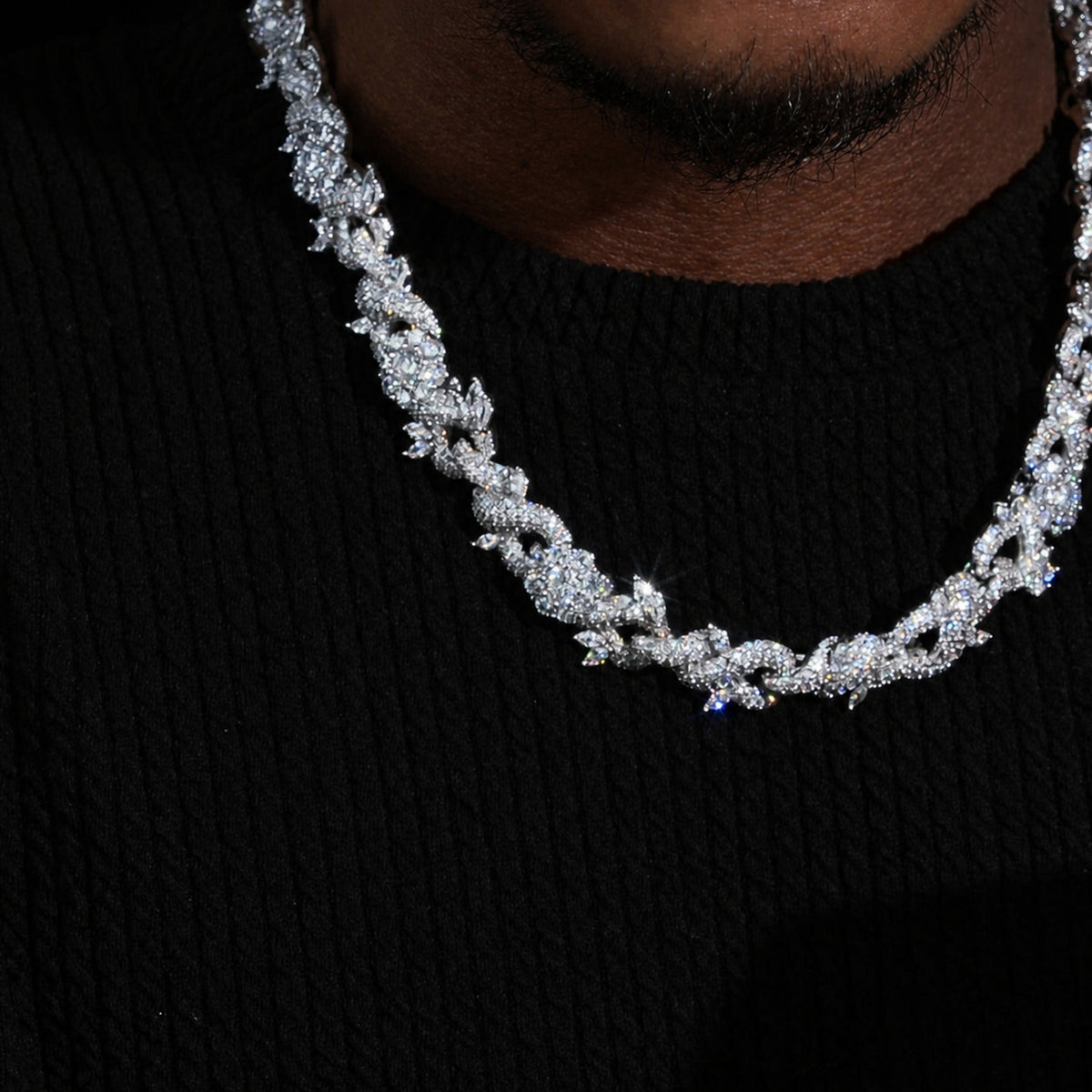 15mm iced flower Cuban chain worn on a deep-brown neck
