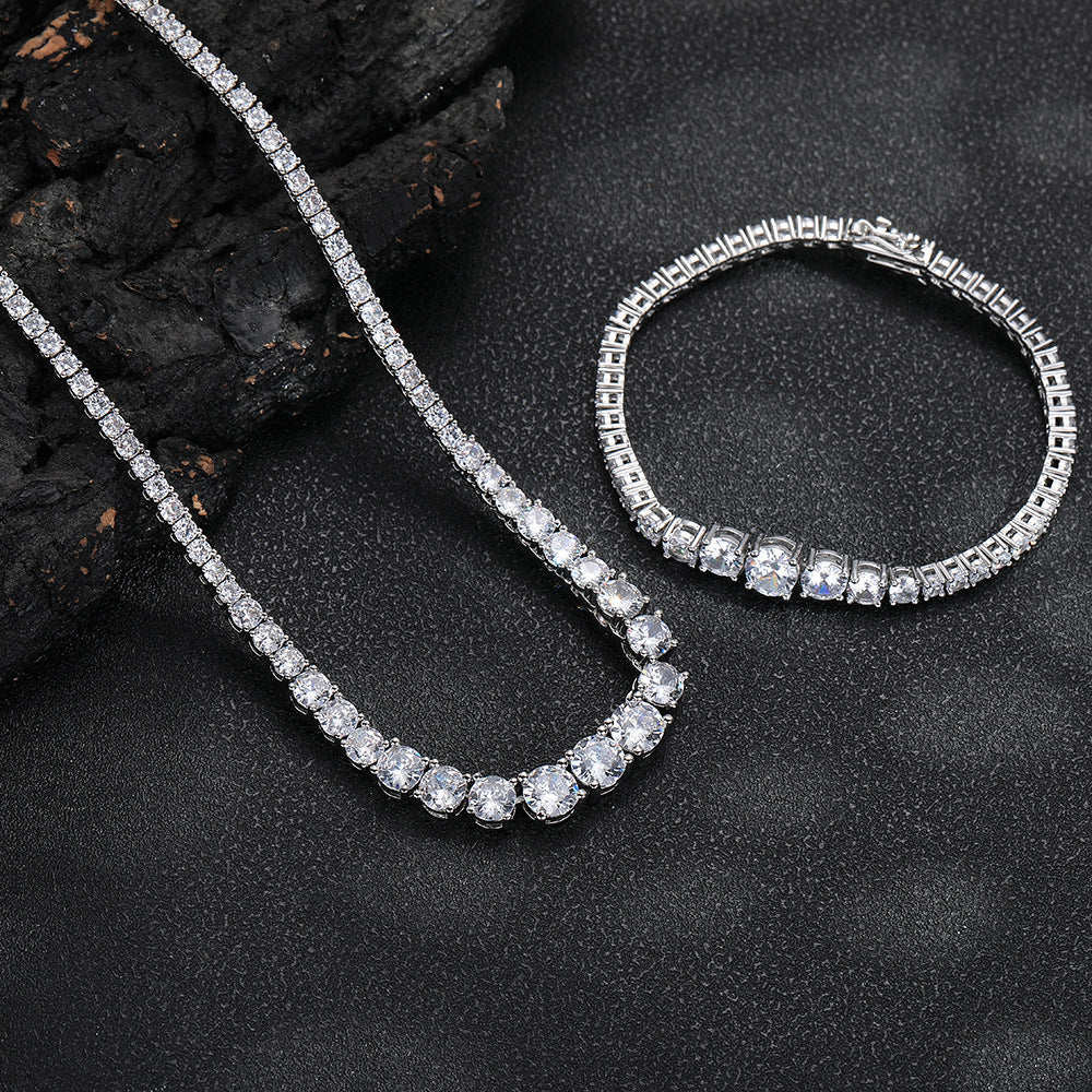 Silver-tone graduated tennis necklace and matching bracelet on dark stone
