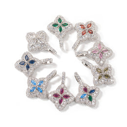 Silver-tone colored four-leaf clover pendants arranged in a circle on white