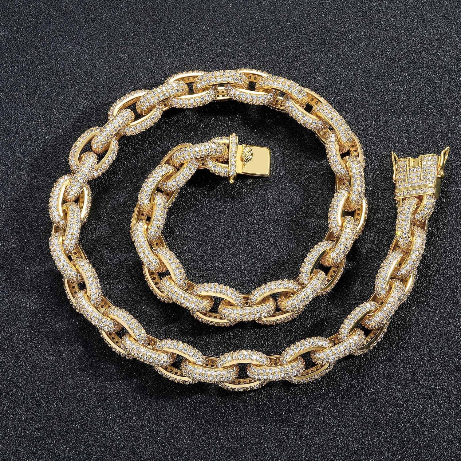 Gold iced O-link chain and bracelet on black