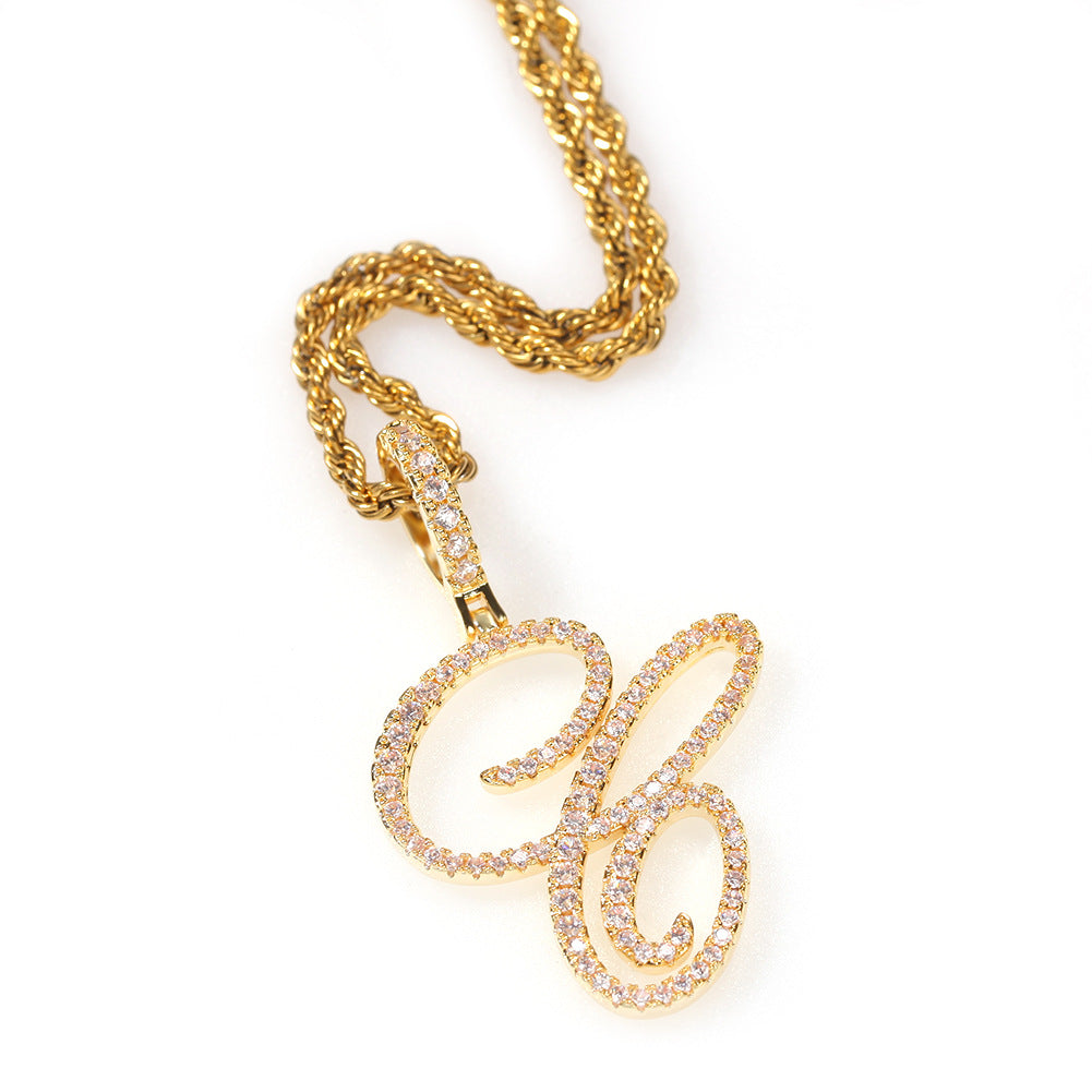 Gold-tone cubic zirconia script letter C pendant on white
