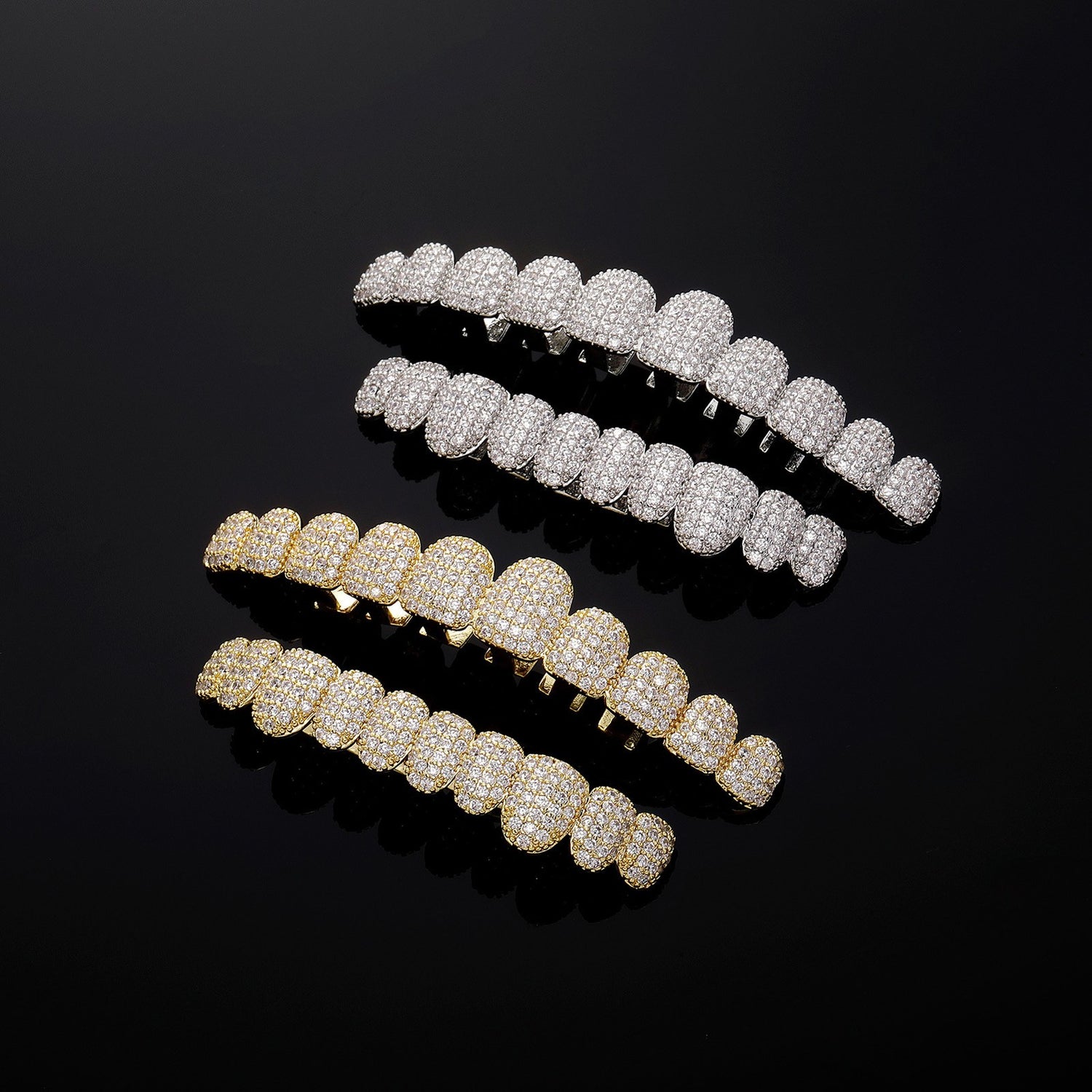Silver and Gold micro-pavé CZ upper and lower grillz on black