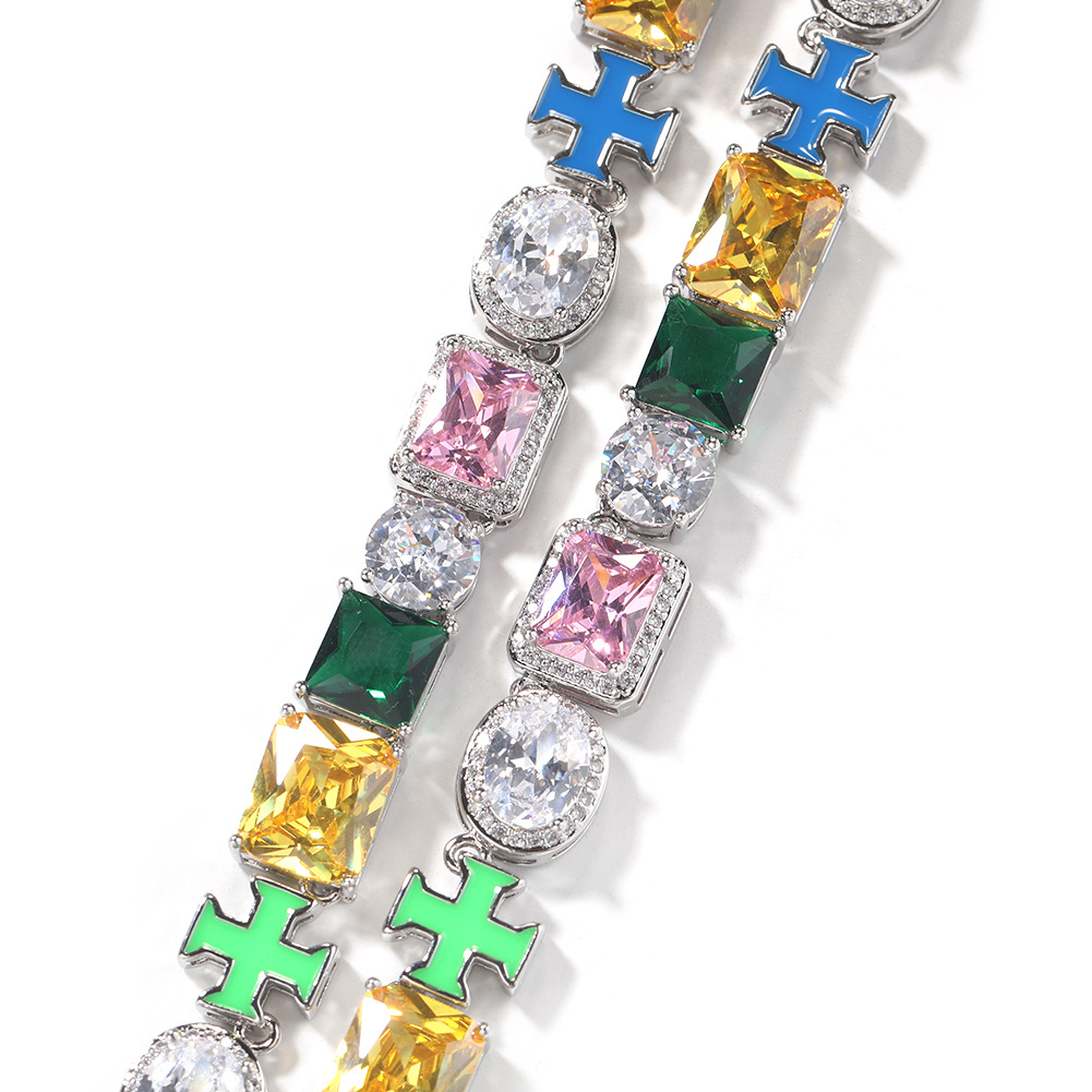 Silver-tone links with clear, pink, green and yellow stones and blue and green cross details