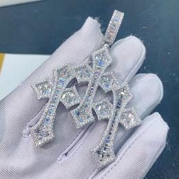 Silver triple Gothic Moissanite cross pendant held in white glove
