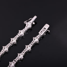 Back of angular tennis-chain settings and open clasp showing an S925 mark