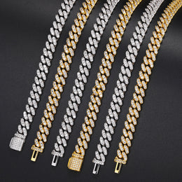 Silver and Gold moissanite Cuban link sections arranged in parallel with box clasps