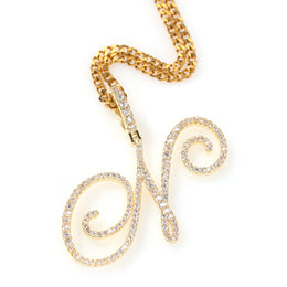 Gold-tone cubic zirconia script letter N pendant on white