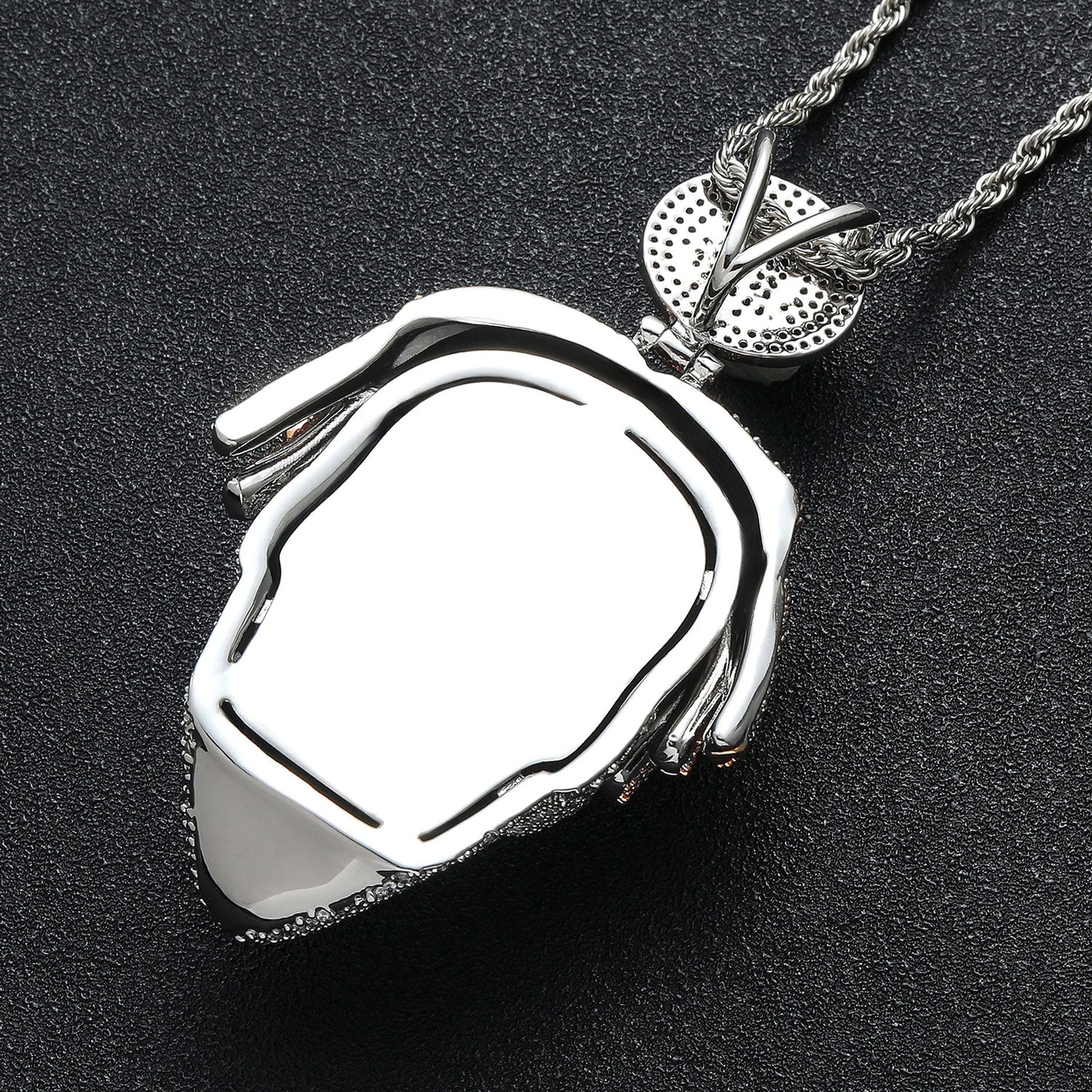 Polished back view of iced mask pendant and Bitcoin bail